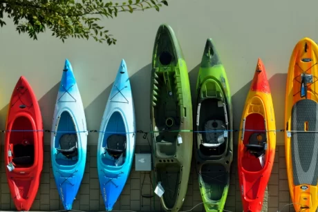 Kayaks lined up agains a wall.