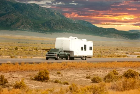 A recreational vehicle driving on the road.