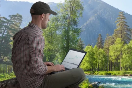 A man working at the side to the river