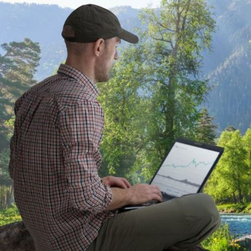 A man working at the side to the river