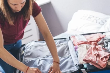 a lady packing her clothes